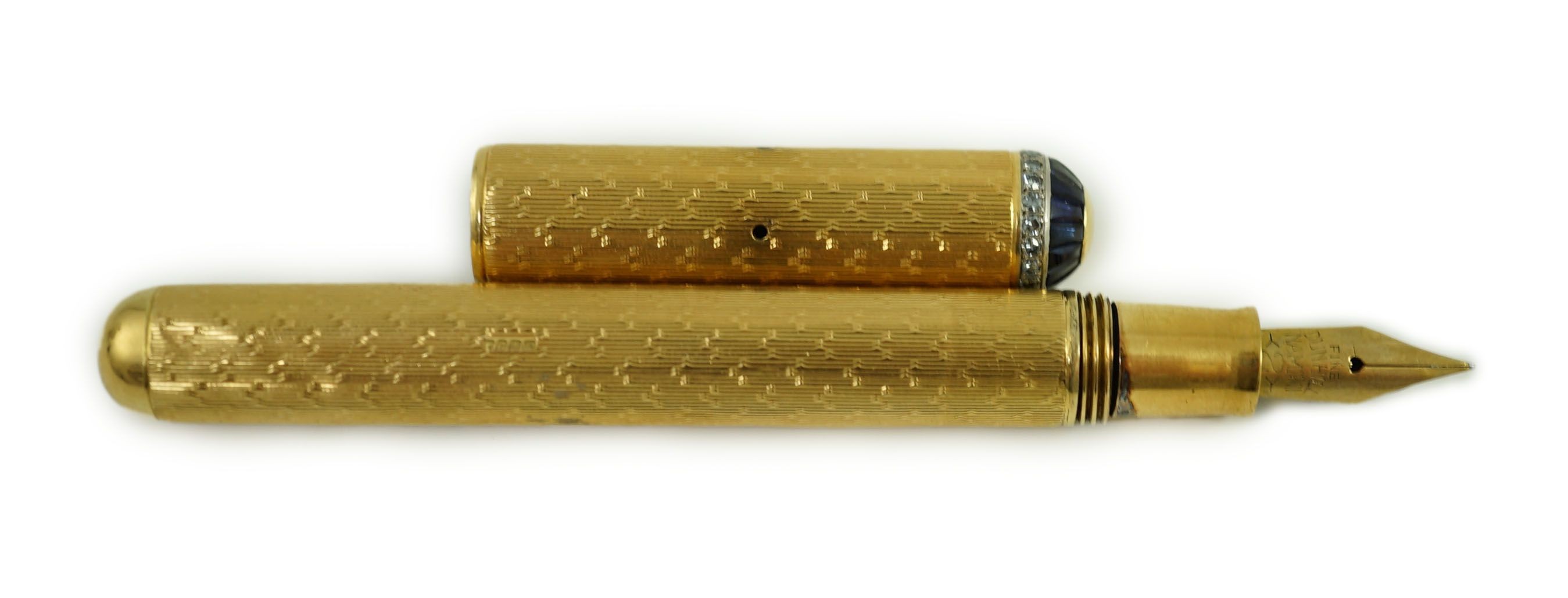 A late 1930's 18ct gold cased and sapphire and diamond set side lever fountain pen, 11cm